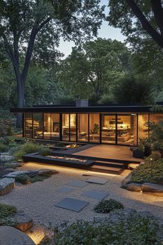 a modern house surrounded by trees and rocks