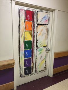 an open door with some colorful paint on it