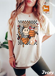 Basketball T Shirt ❤️ Every shirt is hand printed to order, we put so much love into making each shirt  ❤️ If for any reason the shirt didn't live up to your quality standards, contact us and we'll replace it or refund it ❤️ Feel free to send us your special request or if you have a unique idea for a shirt So it's that time again. You need to look for a new T-shirt to wear with your favorite jeans... for that effortless look 😥 You know, the kind that says I woke up like this but takes an hour to execute? 😓 There's no amount of effort you won't put in on your quest to look totally effortless.  After all, you want fashion's latest casual T, not casualty 🤕 Well this is that kind of T-shirt.  Natural and unrehearsed. Casual chic. It's effortless, but not without style 🤩 Wrapped around the Trendy Screen Print Shirt For Fan Merchandise, Trendy Shirt With Fan Merchandise Screen Print, Trendy Fan Merchandise Shirt With Screen Print, Trendy Screen Print Fan Merchandise Shirt, Cotton Screen Print Shirt For Fan Merchandise, Graphic Tee Shirt With Funny Print For Fans, Cotton Graphic Print Shirt For Fan Merchandise, Cotton Graphic Print Shirt For Fans, Cotton Tops With Funny Print For Fans