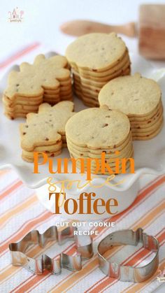 pumpkin toffe cookies on a plate with cookie cutters