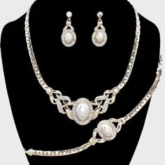 Beautiful Rhinestone Crystal And Pearl Accented 3 Piece Style Bracelet , Necklace And Earrings Statement Fashion Jewelry Set Necklace Size: 16" + 3" L Decor Size: 1" L Bracelet Measures: 3/4" H ; 7" L Dangle Earrings Size: 1 1/4" L Color: White , Silver , Clear Theme: Pearl C 15583 N Elegant Alloy Necklaces For Evening, Formal Rhinestone Alloy Jewelry Sets, Formal Alloy Jewelry Sets With Rhinestones, Elegant White Alloy Jewelry, Elegant Alloy Jewelry Sets, Elegant Metal Jewelry With Rhinestones, Formal Metal Jewelry Sets With Rhinestones, Elegant White Alloy Necklace, Elegant White Alloy Necklaces