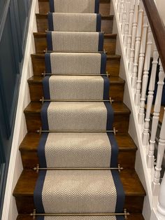 a set of stairs with blue and white carpet