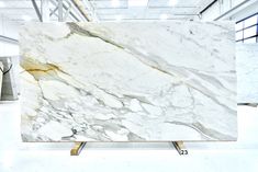 a large white marble slab in a warehouse