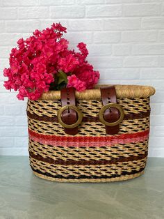 a basket with flowers in it sitting on a table