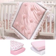 a baby crib bedding set with pink and white flowers