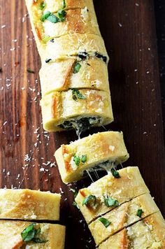 several slices of bread with cheese and herbs