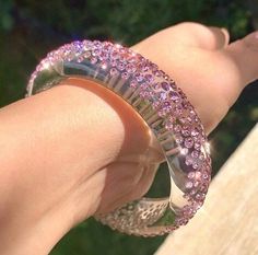 This stunning one of a kind bangle is handcrafted on transparent clear Lucite, while beautifully embellished with over 450 light rose (pink) Swarovski crystal stones. This bangle is lightweight, comfortable to wear, and is perfect for styling up with any look. Super fun to layer and stack with other bangles as well. This bangle looks even more stunning in person especially in the natural sunlight. Arrives beautifully packaged in a luxury gift box and comes included with a polishing cloth. 💎MORE Crystal Bangle Cuff Bracelet For Party, Sparkling Dazzling Bracelets For Gifts, Sparkling Bracelets For Gifts, Glamorous Crystal Bangle Bracelet, Glamorous Crystal Bangle Jewelry, Unique Silver Beaded Bracelets For Party, Dazzling Bangle Bracelet With Sparkling Stones, Clear Bracelet Jewelry For Party, Crystal Jeweled Bangle Bracelet