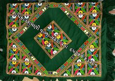 a green cloth with colorful designs on it