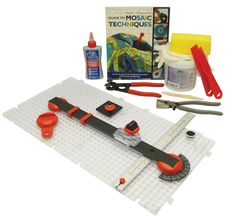 a lego craft kit with scissors, glue, and other items to make a model