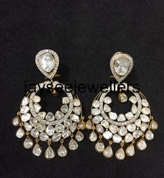 DescriptionBrand: JAYSEE JEWELLERSCountry/Region of Manufacture: IndiaMetal ; Sterling SilverMetal Purity ; 925 parts per 1000Length ; 55 mmWidth : 32 mmTotal Grams Weight: 21.10 GramsGemstone : Polki Diamond Diamond Stone ; DiamondMain Stone : Polki Diamond Stone Color: As Per Seen In PictureStone Shape: As Per Seen In Picture Elegant Rose Cut Diamond Chandelier Dangle Earrings, White Diamond Bridal Earrings, Pierced, White Diamond Pierced Bridal Earrings, White Diamond Chandelier Earrings For Pierced Ears, White Hand Set Chandelier Earrings For Celebrations, Classic White Earrings With Rose Cut Diamonds, Elegant Pendant Earrings For Anniversary, Exquisite Pierced Bridal Earrings, Silver Pendant Earrings With Diamond Accents