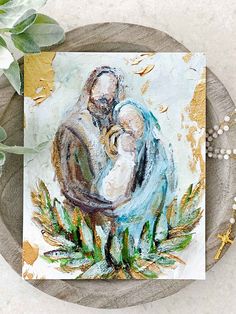 a painting of a man holding a baby on top of a wooden plate next to a plant