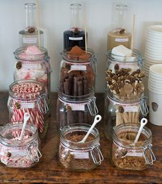 several jars filled with different types of candies