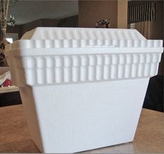 a white plastic container sitting on top of a table