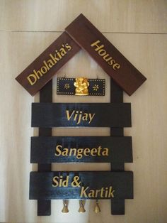 a wooden sign that says dholaki's house and visa sangeeta sid & kartik