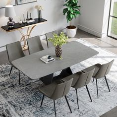 a dining room table with chairs around it