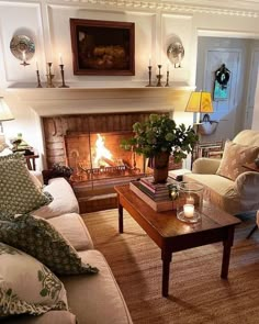 a living room filled with furniture and a fire place in the middle of the room