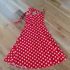 Red And White Polka Dotted Halter Dress Red Retro Knee-length Midi Dress, Red Retro Dress For Spring, Retro Red Knee-length Midi Dress, Retro Red Dress For Spring, Red A-line Sundress For Party, Fitted Red Sundress, Retro Red Lined Dress, Red A-line Sundress, Retro Red Beach Dress