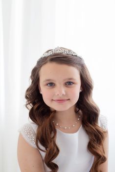 "This brilliant flower girl tiara features sparkling rhinestones with a flower center perfect for the flower girl! This headpiece is perfect for the flower girl, first communion or birthday party! Measuring 1\" high, this sparkling headpiece is sure to add sparkle to your special day!  DETAILS * High quality crystals.  * Measures 1 inch tall. * Has loops on each end to secure with bobby pins. * Perfect for the flower girl, First Communion, birthdays, weddings, parties or any special occasion.  * Finish: silver. SHOP MORE WEDDING JEWELRY & BRIDAL HAIR ACCESSORIES:  http://www.etsy.com/shop/AllureWeddingJewelry SHIPPING * Leaves our facility within 1-2 business days. * Shipping upgrades include priority mail, UPS ground, two-day and overnight delivery." Communion Tiara, Flower Girl Tiara, Girls Tiara, Crystal Tiara, Tiara Wedding, Rhinestone Tiara, Crystal Tiaras, Flower Center, Wedding Tiara