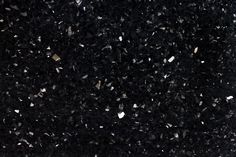 black and white speckles are scattered on the ground