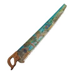 a wooden handled saw with an image of mermaids and dolphins on the front side