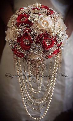 a bridal bouquet with red roses and pearls