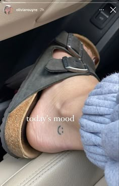 a person's foot with the words today's mood written on it