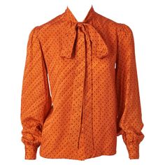 Yves Saint Laurent, Rive Gauche, rust/orange tone, silk jacquard printed, Lavalière, long sleeve blouse, C. late 70's. Rust Blouse, Orange Tone, Jacquard Blouse, Rive Gauche, Rust Orange, Yves Saint Laurent, Shirt Blouses, Sleeve Blouse, Rust