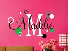 a wall decal with the word's name in black and green