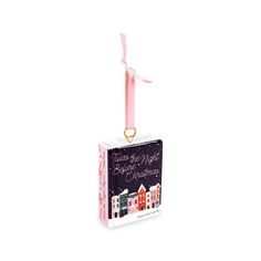 an ornament with a pink ribbon hanging from it