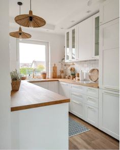 the kitchen is clean and ready for us to use it's counter tops are white