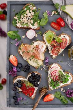 an assortment of food is displayed on a tray