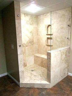 a walk in shower sitting inside of a bathroom