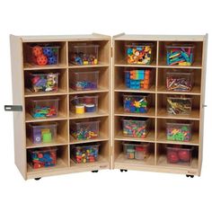 a wooden storage unit filled with lots of toys