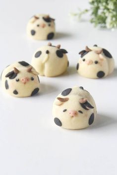 six small cookies with black and white polka dots on them are arranged in the shape of cows