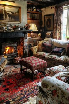 a living room filled with lots of furniture and a fire place in the middle of it