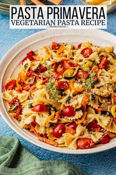 pasta prima vegetata in a white bowl on top of a blue table cloth