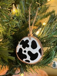 a wooden ornament hanging from a christmas tree