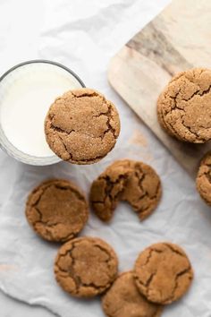 chocolate cookies and milk are on the table