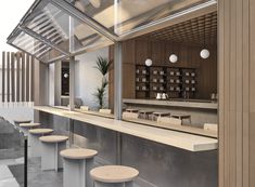 an empty bar with several stools in front of it