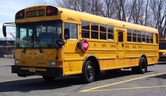 a yellow school bus parked in a parking lot