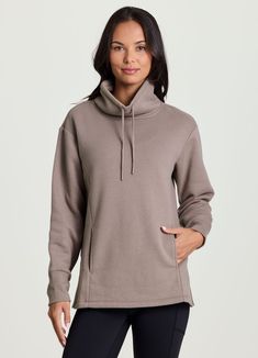 Featuring an adjustable drawstring cowl neck design that promotes warmth and allows for a more customized look and fit, our Downtown Fleece Cowl Neck Tunic provides all-day comfort without sacrificing function. Elevate your athleisure wardrobe with this versatile, cozy sweater that's constructed from ultra breathable, heathered cotton blend fabric with a soft brushed fleece interior and side slits for enhanced air flow. Finished with pockets to stash your essentials, this versatile, legging-frie Cowl Neck Tunic, Yoga Studio, Cozy Sweaters, Cowl Neck, Neck Designs, Athleisure, Cotton Blend, Wardrobe, Sweatshirts