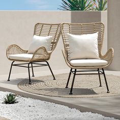 two chairs sitting next to each other on a patio