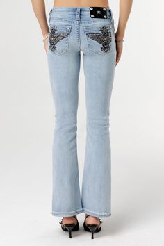 Low-rise, light-wash bootcut jeans- Embroidered winged cross with black leather- Mini rhinestone and pearl details- Rhinestone rivets- Heavy fading Model is wearing size: 26Model Measurements:Height: 5'8"Bust: 35"Waist: 26"Hips: 39" Fabric Content: 52% Cotton, 27% Lyocell, 20% Polyester, 1% ElastaneCare: Gentle machine wash inside-out with like colors in cold water, Tumble dry low Style No. L9339B-L291, L9339BS-L291 Outfit Pieces, Jeans Embroidered, Straight Clothes, Pearl Details, Black Friday Shopping, Low Rise Jeans, Denim Outfit, Leather Mini, Jean Outfits