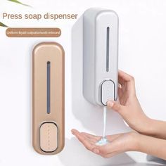 a person is holding the door handle on a soap dispenser