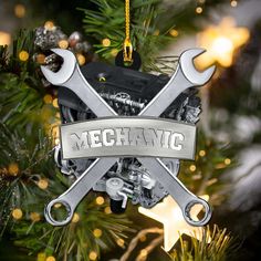 a christmas ornament with wrenches hanging from a tree