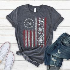 The We The People Shirt, is such a cute shirt for Good Days and great to wear all fall long. We The People Tee, Patriotic T-Shirt, Gift For Women, Gift For Men, 1776 Flag Shirt, History Shirt, Labor Day Shirt, 4Th July Shirt, Gift For People,  Patriotic Flag Tee, Freedom Shirt  HOW TO ORDER  → Please pick your t-shirt type and size. → Please pick your t-shirt color → Select the quantity → Click add to cart  SIZE  → We have size chart on under t-shirt color charts.  ABOUT PRODUCT  Brand of Shirts Patriotic Shirt Ideas, Patriotic Shirt Designs, Cotton Tops With Flag Print For Fall, 4th Of July Shirt Ideas, Memorial Day Shirts, 1776 Flag, Tassel Shirt, American Holidays, Fun Shirts