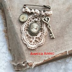 a piece of fabric with an antique key and clock on it