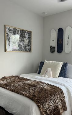 a bedroom with two skateboards mounted to the wall