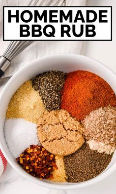 the ingredients for homemade bbq rub in a white bowl on a marble counter top