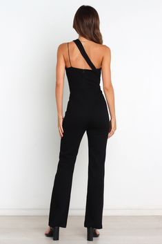 DETAILS   If you're planning for the perfect party jumpsuit, look no further! Our one shoulder jumpsuit is the perfect choice to make a statement. This jumpsuit has a double one shoulder strap feature and an invisible zip at the back.  If you are in between sizes,   we do suggest selecting the size down due to the to stretch in this fabrication.   one shoulder style  double one shoulder strap feature  back invisible zip   stretch material   unlined   material - 70% Cotton 25% Nylon 5% Spandex Satin Dresses Long, Satin Dresses Long Sleeve, Party Jumpsuit, Petal And Pup, Black Tie Wedding Guests, White Dress Shoes, One Shoulder Jumpsuit, Resort Dresses, Essential Dress